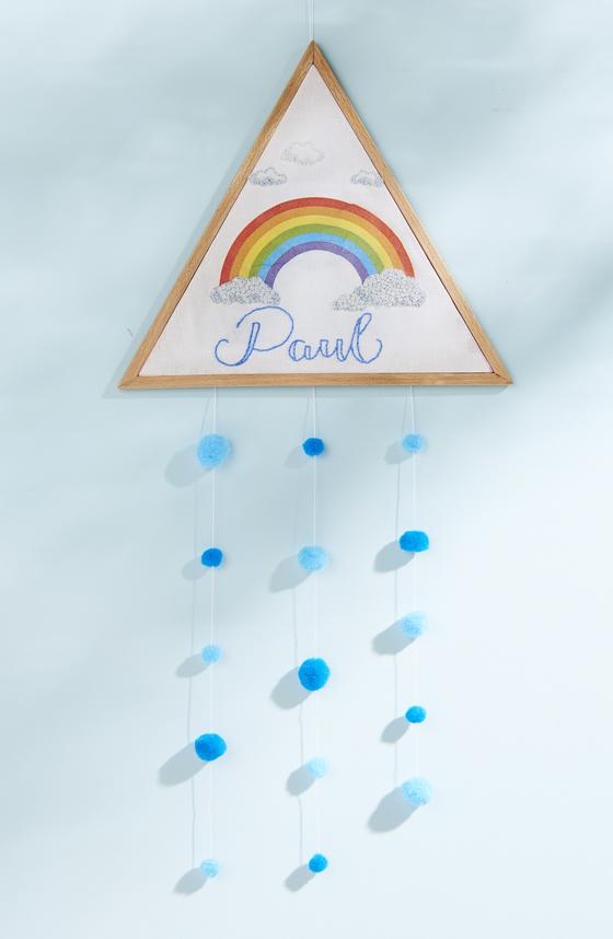 Dekorahmen zur Geburt mit Regenbogen