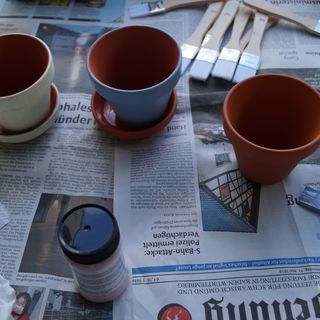 Children's handicrafts: Painting and planting clay pots