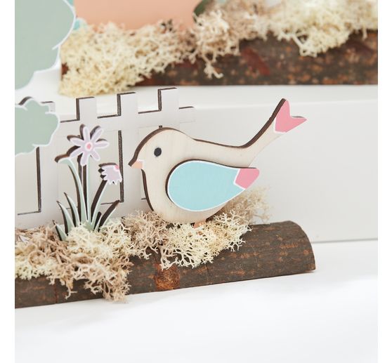 VBS Wooden building kit on tree trunk